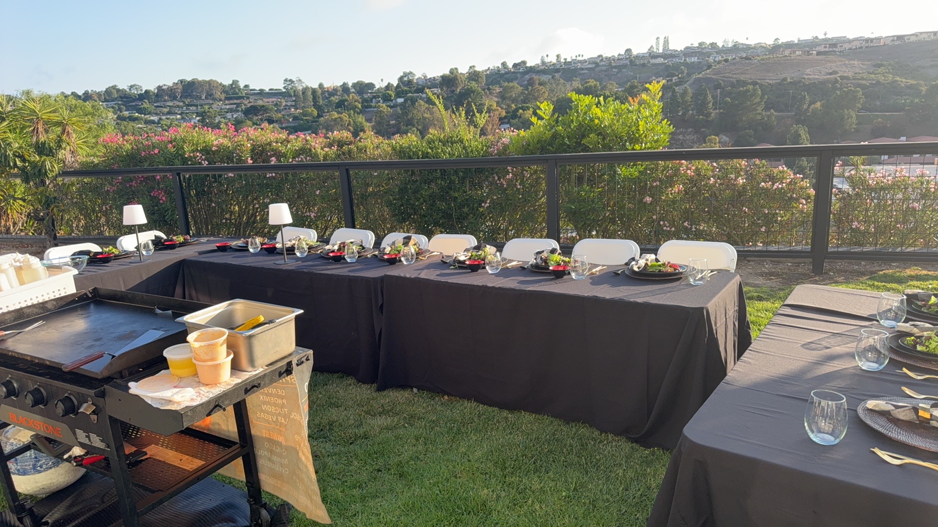 Outdoor hibachi setup with tables and grill