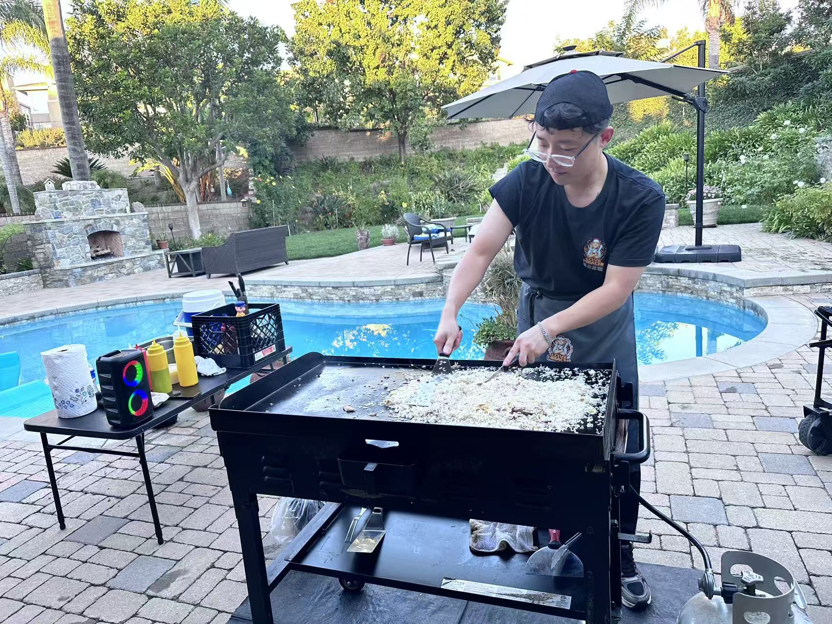 Love Hibachi chef preparing food at a backyard party
