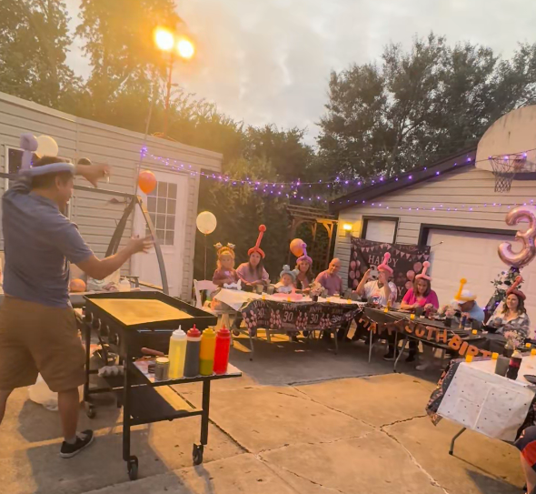 A tiny laptop in the palm of a hand