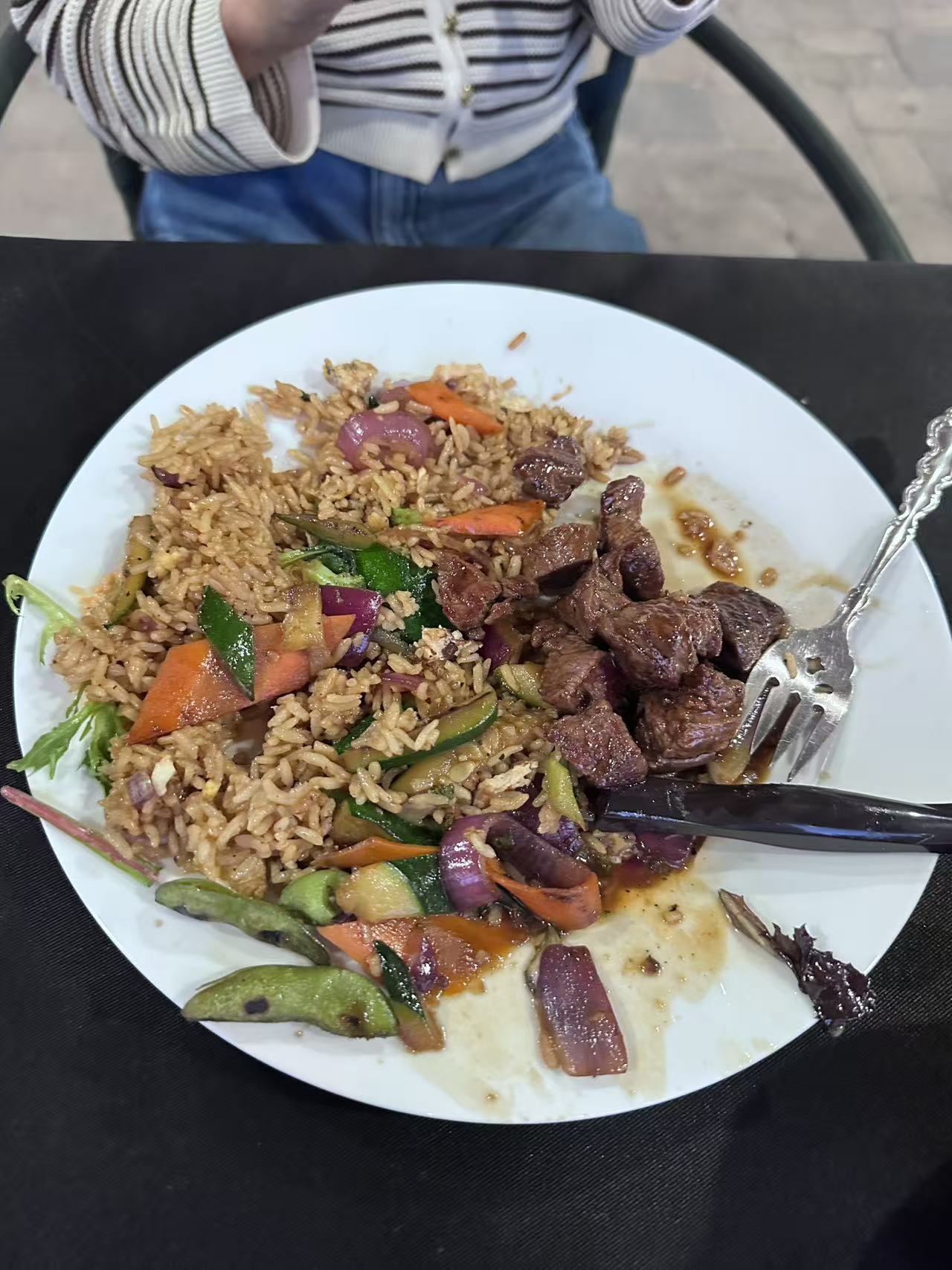 A tiny laptop in the palm of a hand